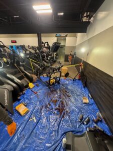 Commercial stair climber undergoing professional repair to protect long term value for gym equipment