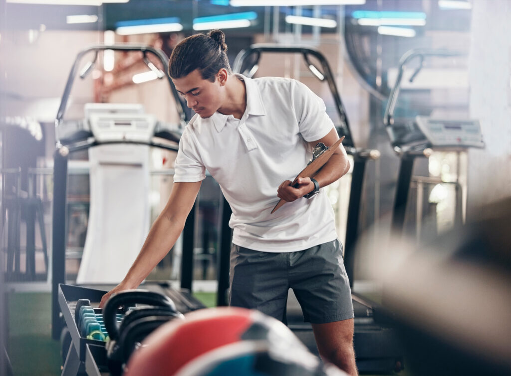 Fitness equipment service helps keep weights organized and commercial gym equipment ready for daily facility operations.